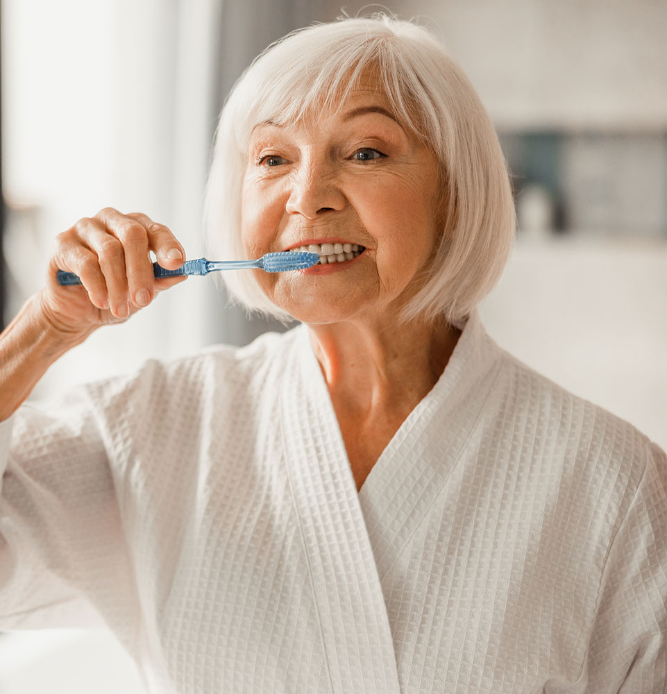 lady brushing her teeth