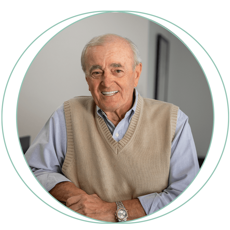 man with vest sweater collared shirt